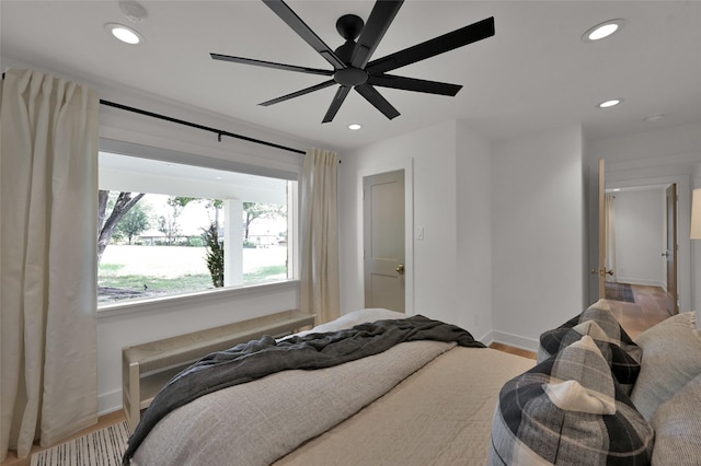 bedroom with recessed lighting, ceiling fan, baseboards, and wood finished floors