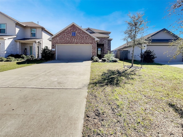 view of front of house with brick siding, fence, concrete driveway, a front yard, and an attached garage