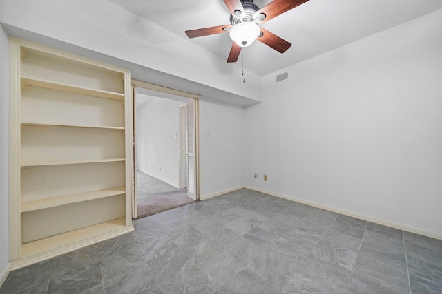 unfurnished bedroom featuring ceiling fan, visible vents, and baseboards