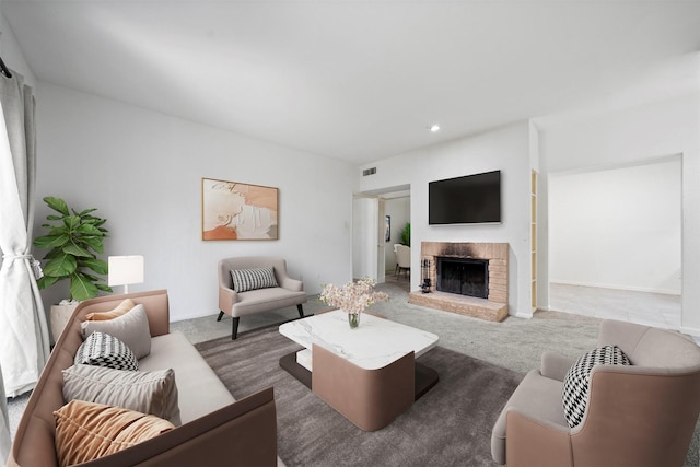 living room with carpet floors, a brick fireplace, visible vents, and recessed lighting