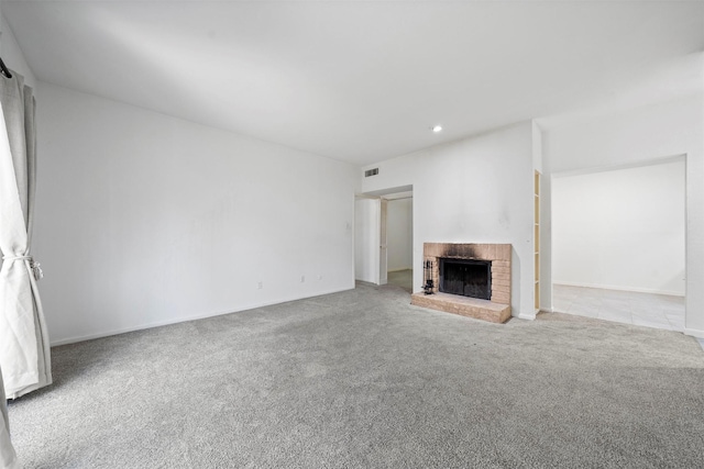 unfurnished living room featuring recessed lighting, a fireplace, carpet flooring, visible vents, and baseboards