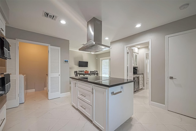 kitchen featuring black electric cooktop, visible vents, white cabinetry, dark countertops, and island exhaust hood