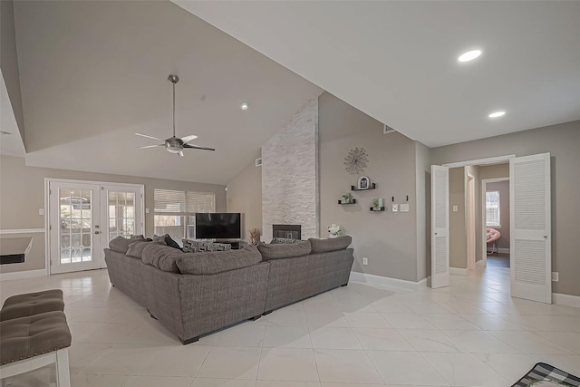 living area with a healthy amount of sunlight, recessed lighting, a ceiling fan, and french doors