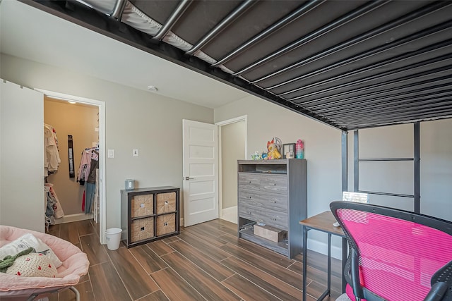 interior space featuring wood finish floors and baseboards