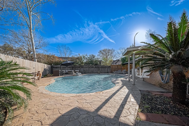 view of pool with a patio area, a fenced backyard, and a fenced in pool