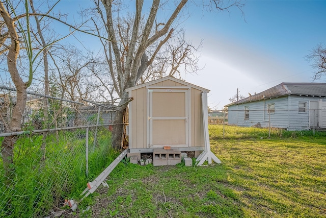 view of shed with fence