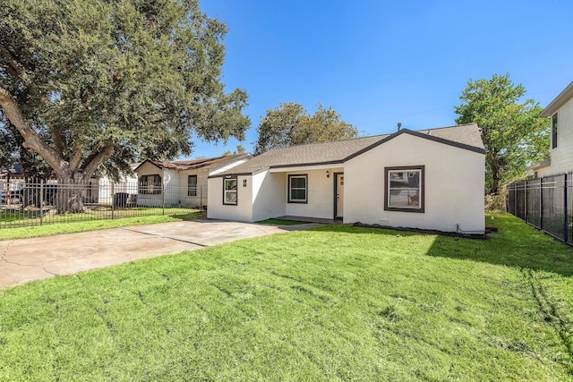 single story home featuring driveway, fence, a front lawn, and stucco siding