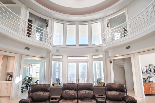 4214 Turks Pt, Galveston, TX 77554 - living area with french doors, visible vents, and a towering ceiling