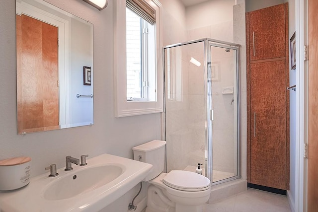 4214 Turks Pt, Galveston, TX 77554 - full bath with toilet, a stall shower, tile patterned flooring, and a sink