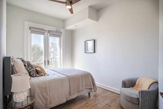 4214 Turks Pt, Galveston, TX 77554 - bedroom with french doors, wood finished floors, and a ceiling fan
