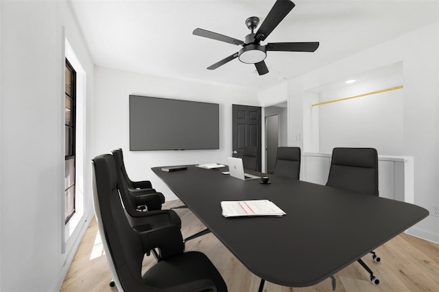 office area with ceiling fan and light wood-style flooring