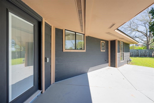 view of patio / terrace featuring fence