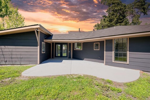 back of house featuring a yard, french doors, and a patio area