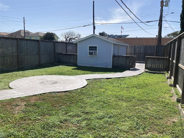 view of yard with an outbuilding and a fenced backyard