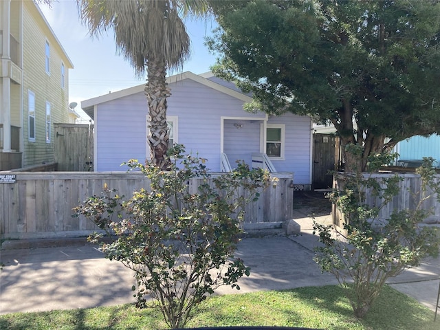 view of front of home featuring fence