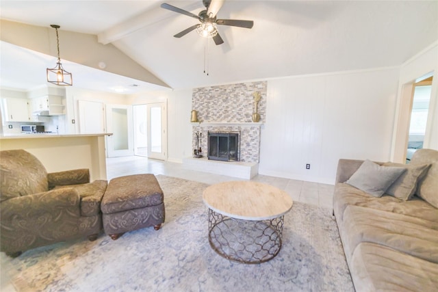 living area with a large fireplace, ceiling fan, light tile patterned floors, and lofted ceiling with beams