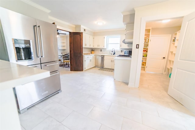 kitchen with stainless steel appliances, light countertops, ornamental molding, backsplash, and open shelves