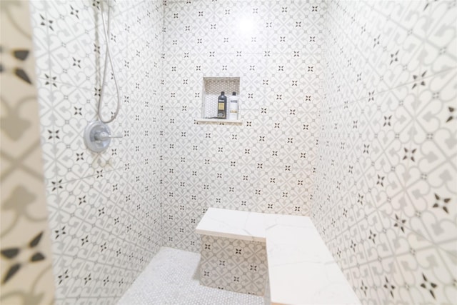 interior space featuring a tile shower