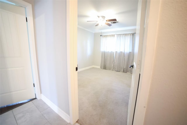 interior space featuring visible vents, ornamental molding, baseboards, and tile patterned floors