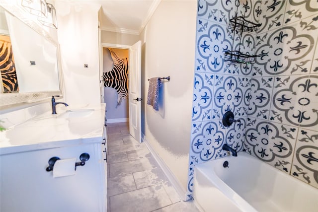 bathroom featuring ornamental molding, baseboards, vanity, and washtub / shower combination