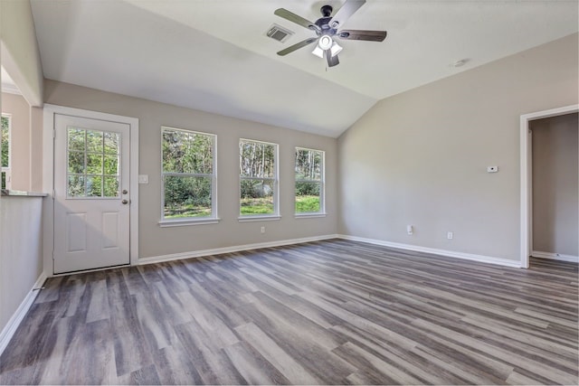 interior space with vaulted ceiling, wood finished floors, visible vents, and a healthy amount of sunlight