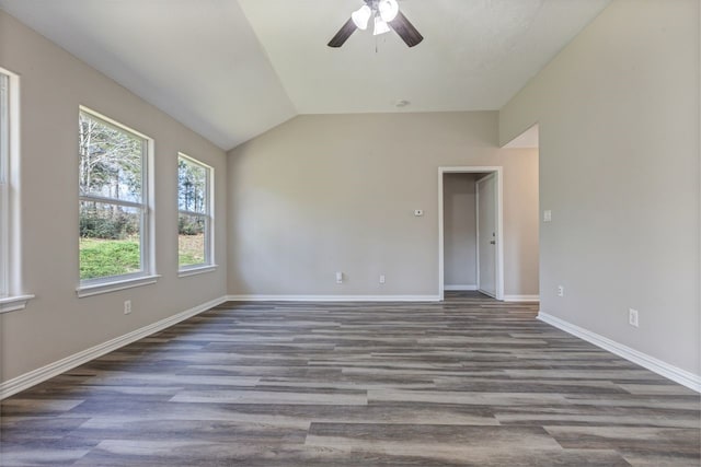 unfurnished room with ceiling fan, baseboards, vaulted ceiling, and wood finished floors