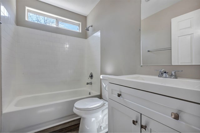 bathroom with toilet, shower / washtub combination, wood finished floors, and vanity