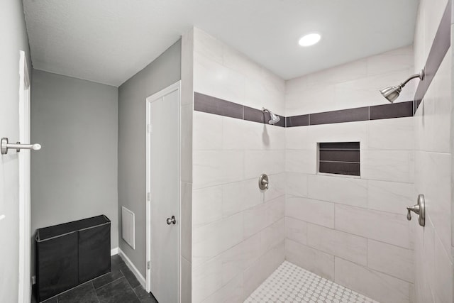 full bathroom featuring visible vents and a tile shower