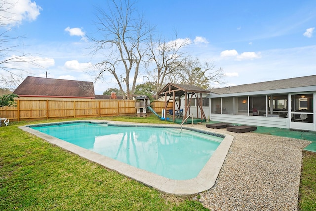 view of pool featuring a playground, a lawn, a fenced backyard, and a sunroom