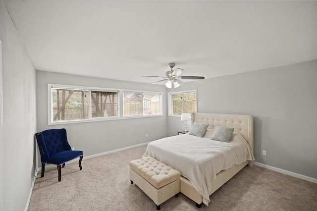 bedroom with carpet flooring, ceiling fan, and baseboards