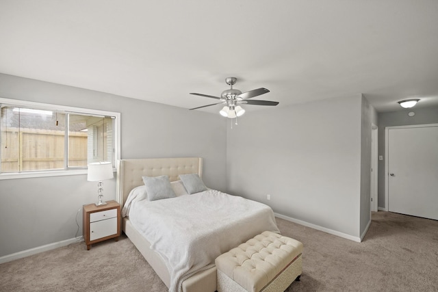 bedroom featuring baseboards, carpet floors, and ceiling fan