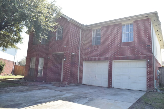 view of front facade with a garage, concrete driveway, and brick siding