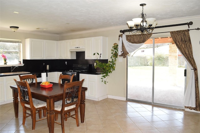 dining space with a notable chandelier, crown molding, and light tile patterned flooring