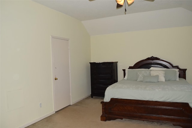 bedroom featuring lofted ceiling, baseboards, a ceiling fan, and light colored carpet