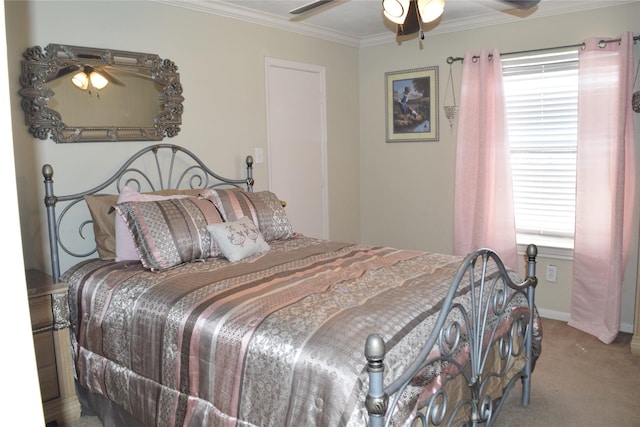 bedroom featuring baseboards, crown molding, a ceiling fan, and carpet flooring