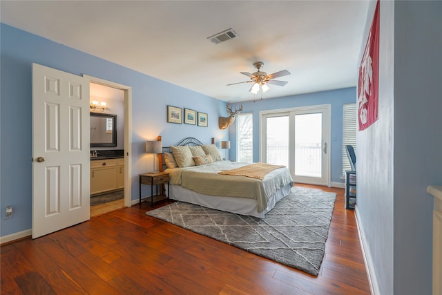 bedroom featuring baseboards, access to outside, visible vents, and dark wood-style flooring