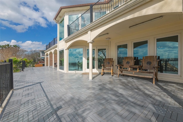 view of patio with a balcony