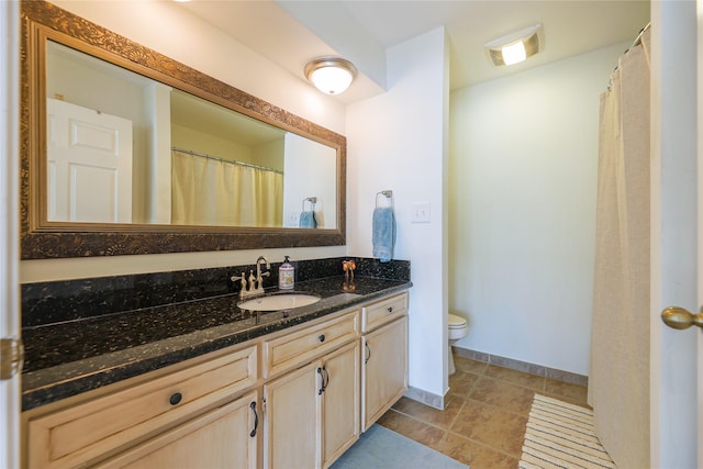 full bath with visible vents, toilet, vanity, baseboards, and tile patterned floors