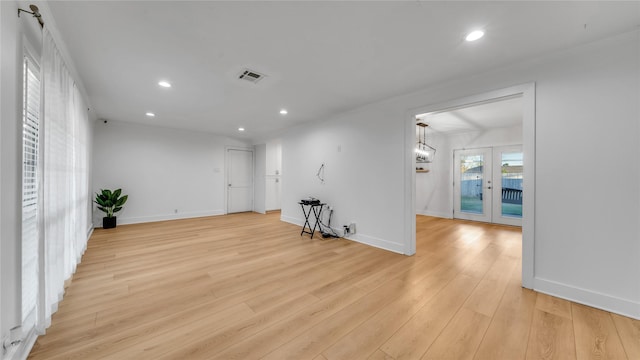 unfurnished room featuring recessed lighting, french doors, light wood-style flooring, and baseboards