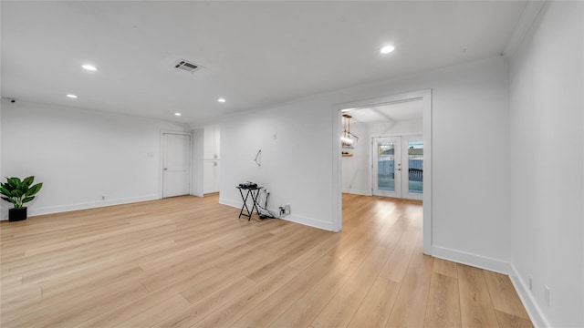 empty room with recessed lighting, visible vents, light wood-style flooring, and baseboards