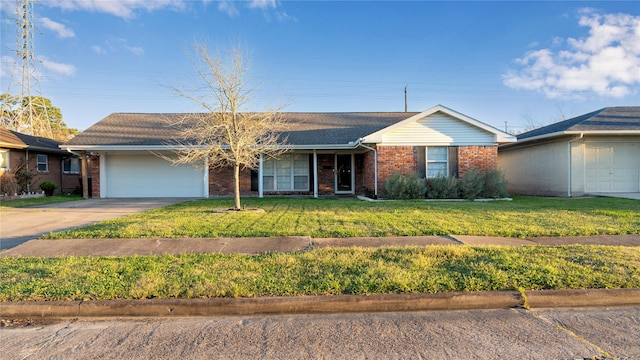 ranch-style house with an attached garage, a front yard, concrete driveway, and brick siding