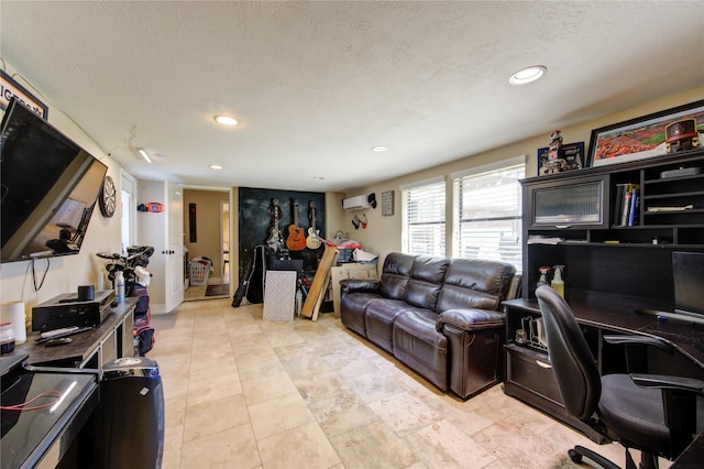 living area featuring an AC wall unit, light tile patterned floors, a textured ceiling, and recessed lighting