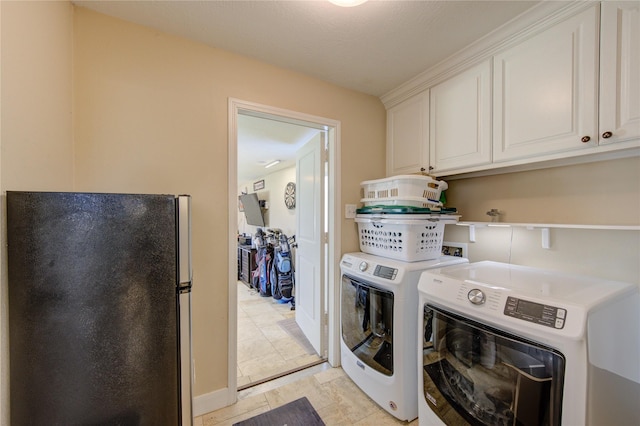 laundry area featuring cabinet space and washing machine and dryer