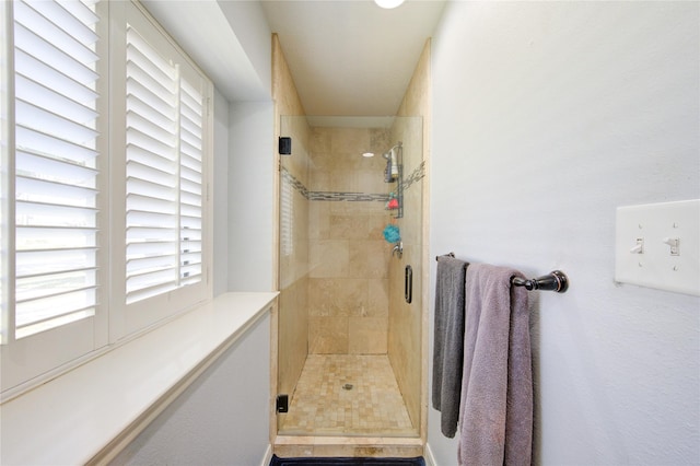 bathroom with a stall shower