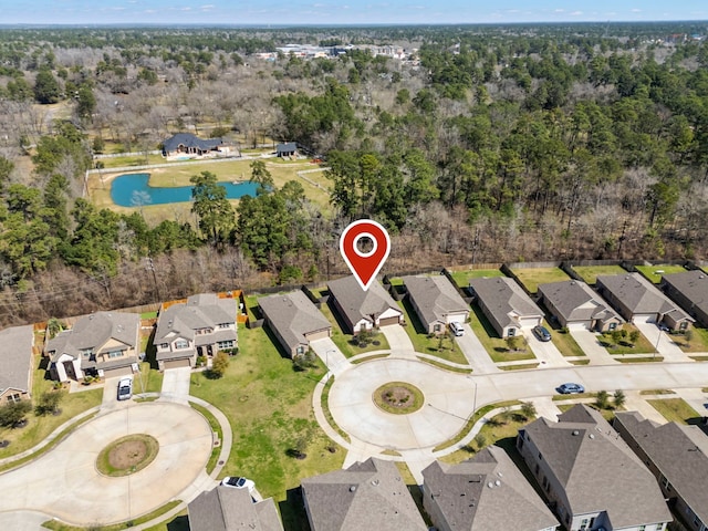 bird's eye view featuring a water view and a residential view