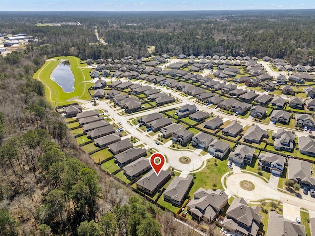 birds eye view of property featuring a water view and a residential view