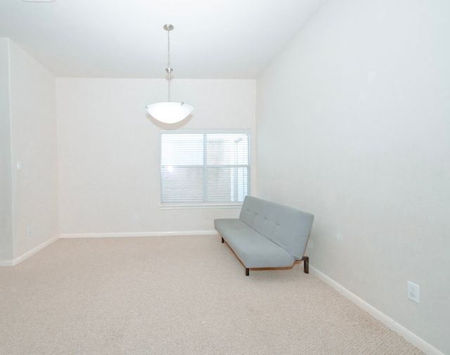 sitting room with carpet floors and baseboards