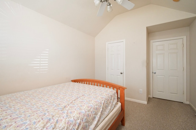 bedroom featuring vaulted ceiling, light carpet, a ceiling fan, and baseboards