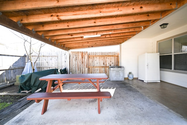 view of patio / terrace featuring fence and outdoor dining area