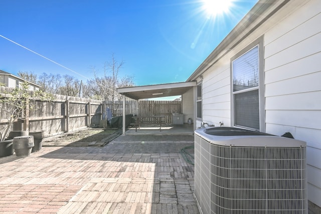 view of patio / terrace with central AC unit and a fenced backyard